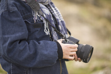 young documentary photographer woman taking photos on mountain trip