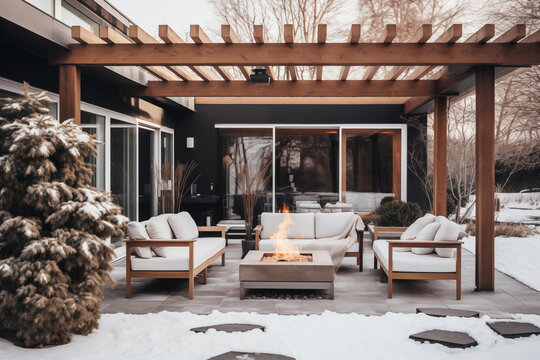 Cozy backyard deck with fire pit And sitting area in winter