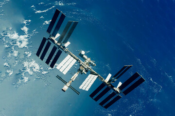 ISS above the surface of planet earth. Elements of this image furnished by NASA