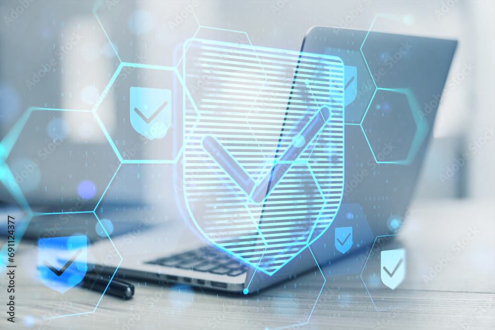 Poster Close up of laptop computer at desk with glowing hexagonal shield hologram and binary coding on blurry background. Safety and internet concept. Double exposure.
