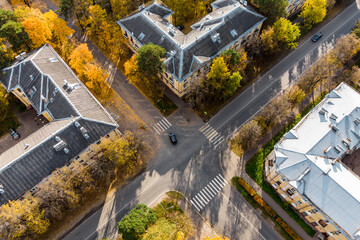 Unregulated road intersection, autumn cityscape from the air