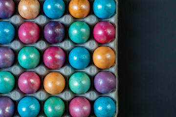 Easter background with hand painted purple, blue, green, orange