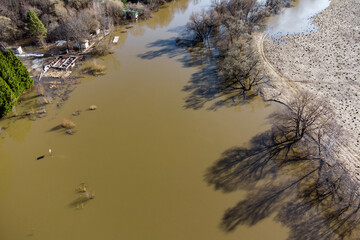 Drone view of an overflowing river during spring floods