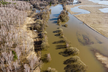 Drone view of an overflowing river during spring floods