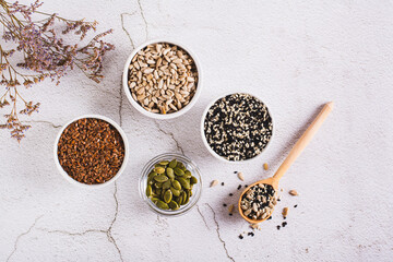 Balance female hormones with pumpkin, flax, sesame and sunflower seeds top view