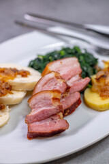 smoked flank with potato and bread dumplings and spinach