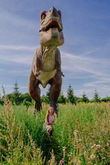 Beautiful girl running from dinosaur
