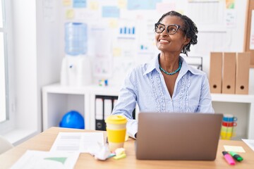 Middle age african american woman business worker using laptop working at office