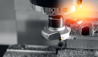 Working closeup CNC turning cutting metal Industry machine iron tools with splash water.
