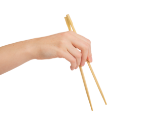 Hand holding wooden chopsticks, Chinese food sticks isolated on white background png