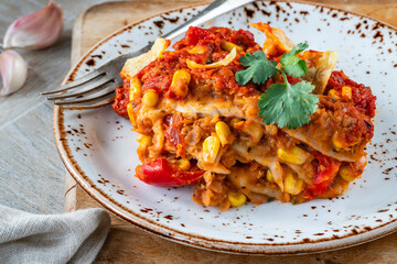 Vegetarian enchilada bake with smoky lentils and sweetcorn