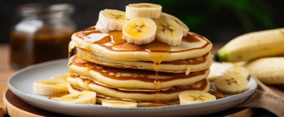 hot fresh made pancakes with slices of bananas - Powered by Adobe