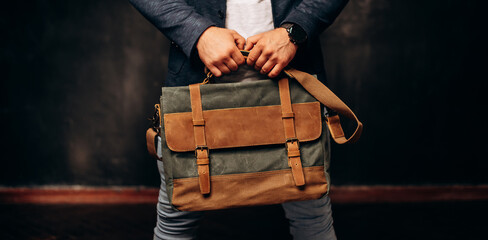 style and people concept - close up of hipster man with stylish shoulder bag