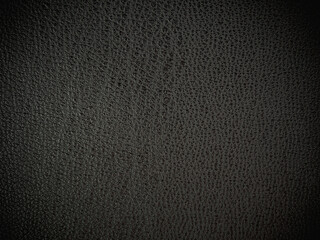 Texture of black leather clothing fabric selective focus