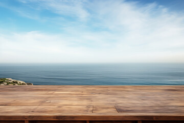 Empty wooden table with scenic sea and blue sky in blurry background