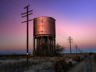 Morning colors along a railroad with a water tower