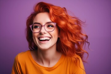 a smiling woman wearing glasses and smiling at the camera, wearing an orange t -