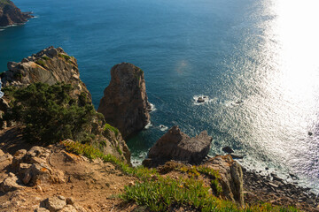 Fototapeta na wymiar Cabo de Roca or Roca cape, most western point of Europe, where the mainland ends and the Atlantic begins, sunlight, landscape