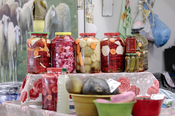 A Table Overflowing with a Colorful Array of Jars Filled with Delicious, Preserved Foods from Obor...