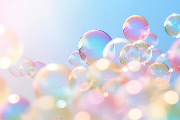 Soap bubbles floating in the air on pastel gradient background. Iridescent bubbles. Dreaming, fun and joy concept. Abstract pc desktop wallpaper. Cleaning and washing theme