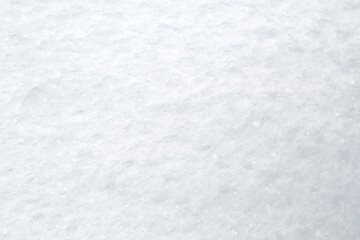 Close-up of fresh and bright snowy land in the winter, viewed from above. Abstract full frame...