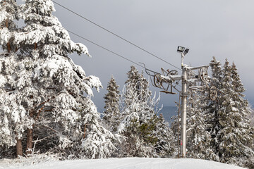 Rope tow, ski lift  at the top of snowy mountain. Zuberec Ski Park. Slovakia. Western Tatras....