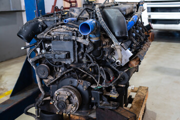 Fototapeta na wymiar Disassembled engine at a truck repair service