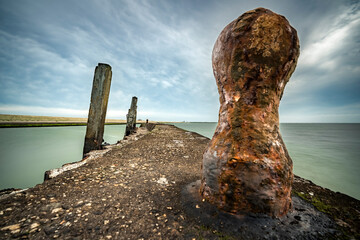 Rests of an old harbor for ships in the Oosterschelde National Park. long exposure picture