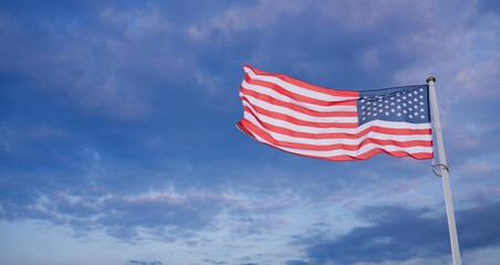 American flag waving in wind. Symbol of the United States of America.