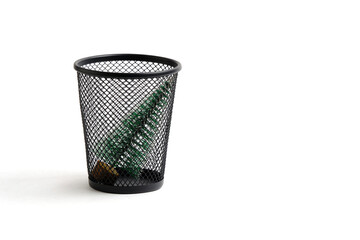 Christmas tree was thrown in trash. Concept completing winter holidays.