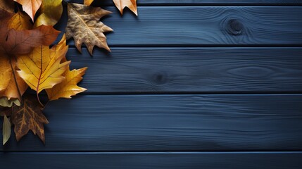 A wooden background in a blue color with autumn leaves and organic products