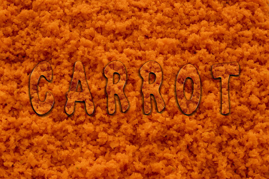 Hintergrund von Karoten voll mit dem geriebenen 
 frische Karoten und in der Mitte ist schrift CARROT auf englisch