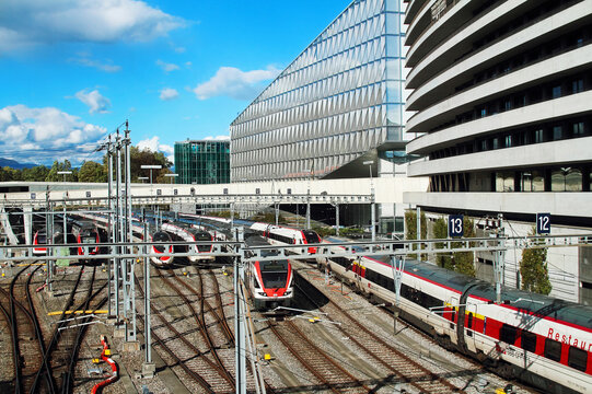View of the Geneva Secheron railway station with many trains.