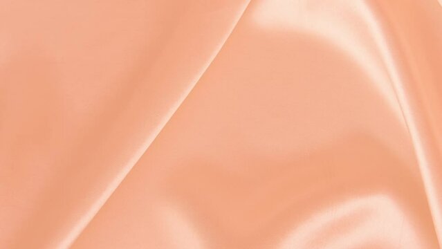 peach fuzz Color year 2024, peach silk fabric, delicate satin, elegant silk, background for designer, text mockup, luxury Color trend palette concept, texture, Frankfurt - December 7, 2023