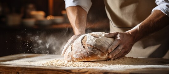 Close up view of baker cutting bread dough with steel scraper in bakery. Copy space image. Place for adding text - obrazy, fototapety, plakaty