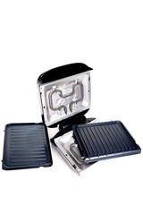 electric grill with non-stick coating. Removable non-stick plates. on white background, close-up