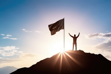 Backlit image of a Silhouette of a businessman holding a flag on the top of the mountain  - obrazy, fototapety, plakaty