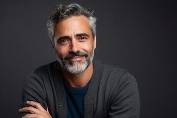 Portrait of a handsome middle-aged man with grey hair and beard