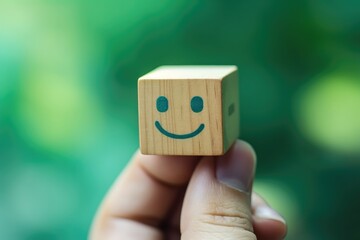 Smiling green happy face Smiley Laugher, friendly happy square cube wooden smile satisfied client review experience, customer success, client service good positive feedback, lucky affirmation