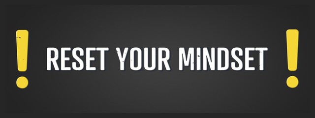 Reset your mindset. A blackboard with white text. Illustration with grunge text style.