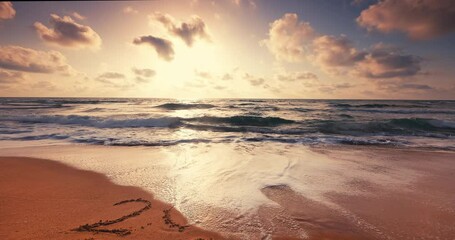 2024 new year text written in sand on a tropical beach during beautiful sunrise with clouds over sea waves and exotic island - Powered by Adobe