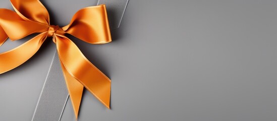 Orange ribbon rope, gray background, top view