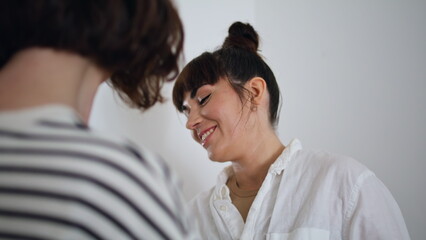 Happy tattooist working with client at home portrait. Smiling master talking