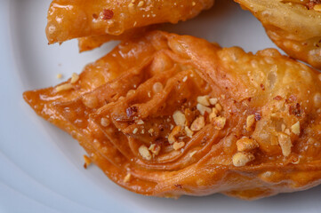 Turkish baklava, sweet dessert with honey on a light plate 7