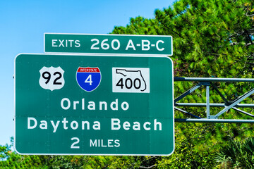 Close up view of road direction sign above highway near Daytona Beach, Florida
