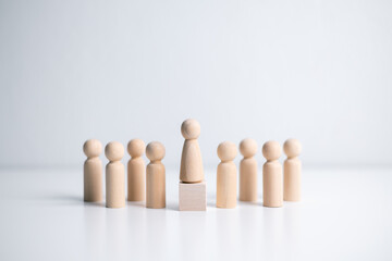 Wooden figure standing on the box for show influence and empowerment. Concept of business leadership for leader team, successful competition winner and Leader with influence