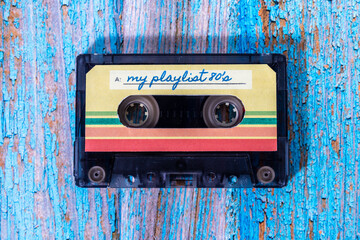 Top view of a music cassette with my playlist labels on wood with pickled paint.