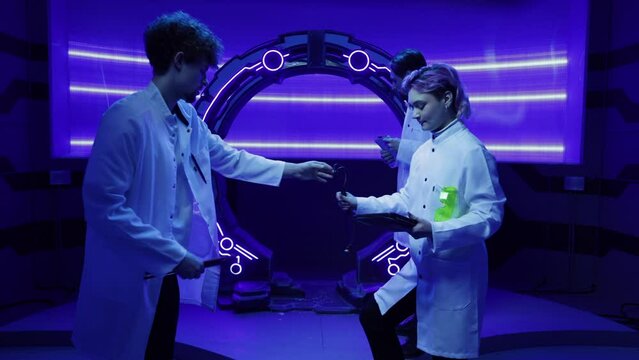 Young male and female scientists looking joyous after successful researching tests. Spaceship crew in white uniform preparing for open space journey. High quality 4k footage