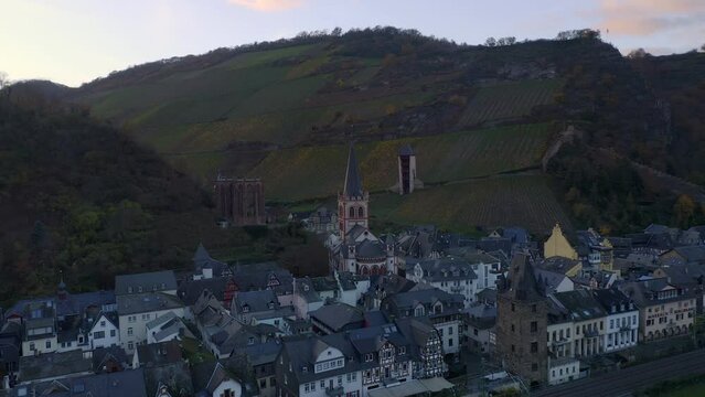 Drone aerial view of Bacharach traditional village with Rhine river at sunset in Germany