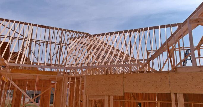 In newly constructed residential building, wooden roofing rafters joist trusses have been installed